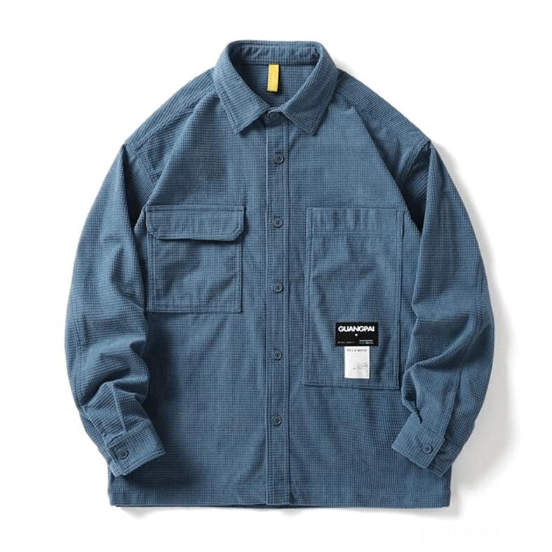 Dusty blue waffle texture gothic shirt studio flat lay - button closure and pocket details