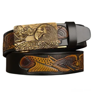 Eagle embossed gothic leather belt with antique brass buckle and black-tan color scheme, flat lay product view