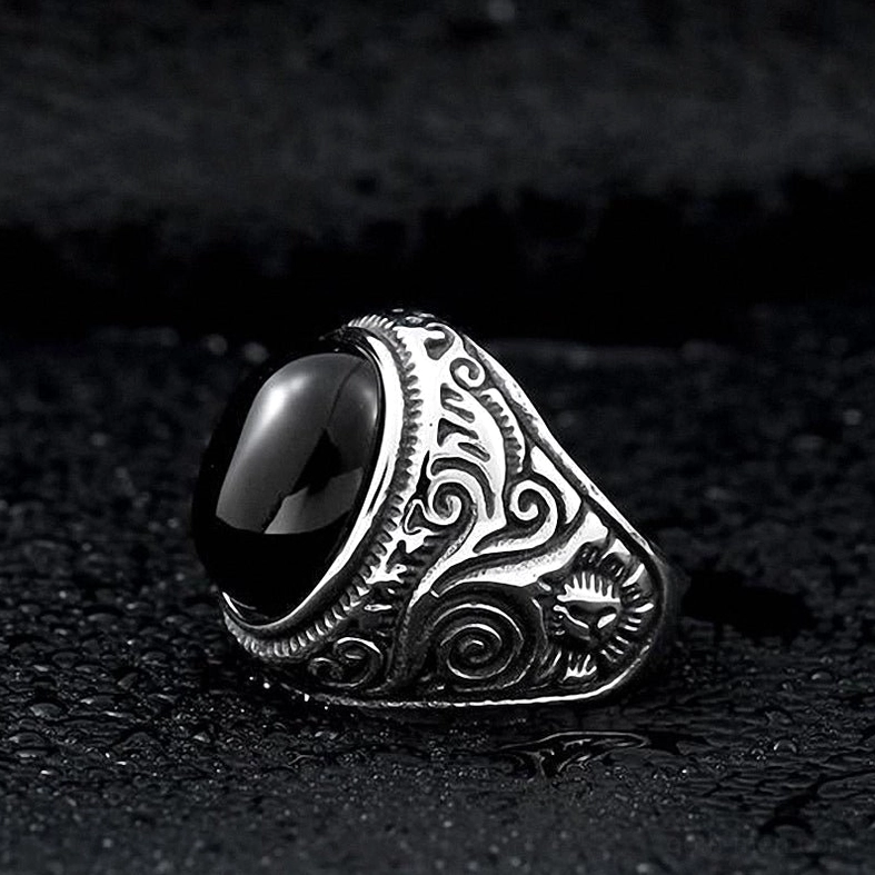 Embossed gothic ring design, ornamental scroll patterns, dark aesthetic jewelry detail