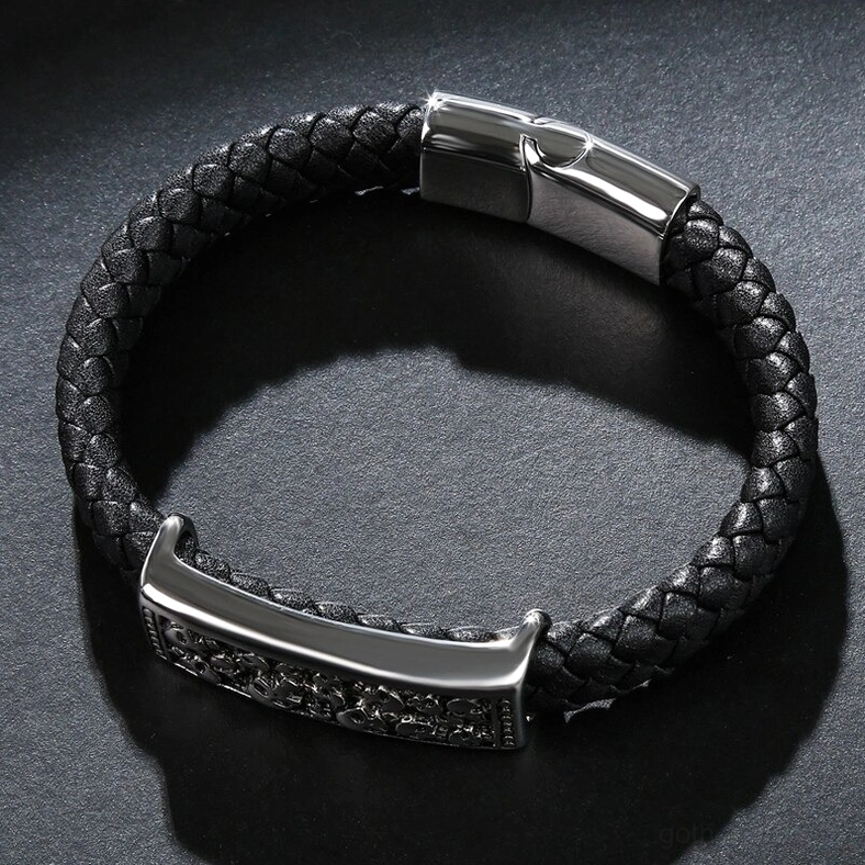 Top-down view of engraved skull leather bracelet with magnetic silver clasp, gothic aesthetic detail