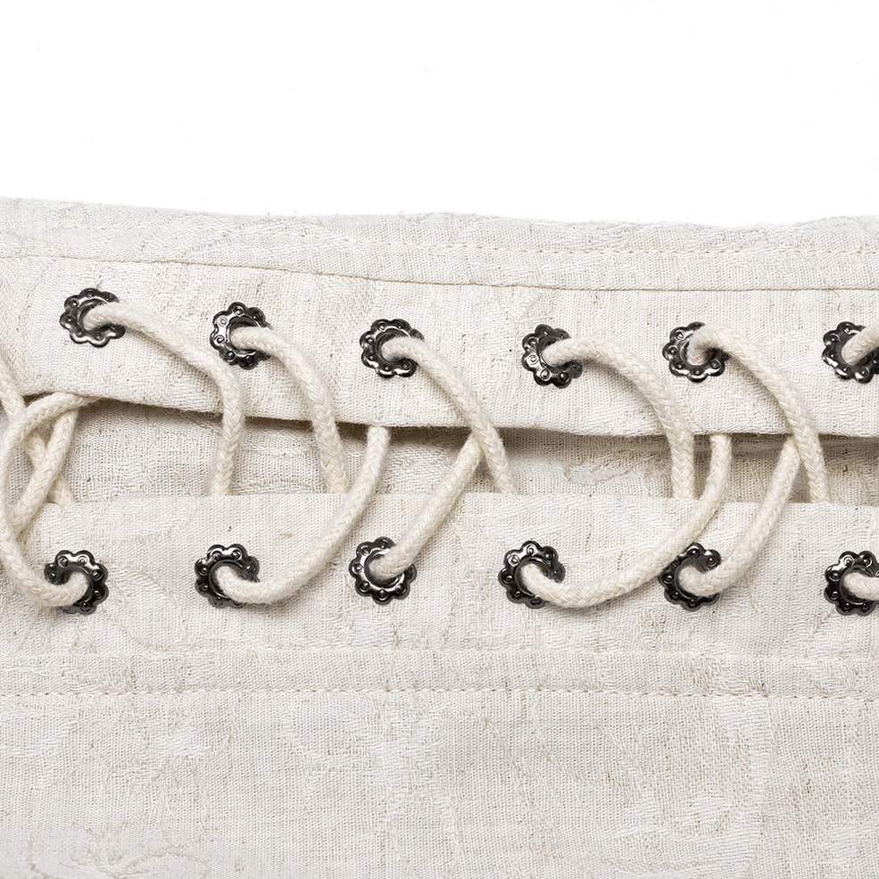 Close-up of eyelet chain shoulder hardware - metal eyelets and rope lace fasteners on gothic linen shirt