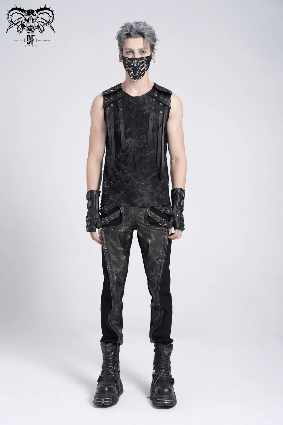 Close-up of eyelet strap metal rivets and distressed black fabric on industrial gothic tank top
