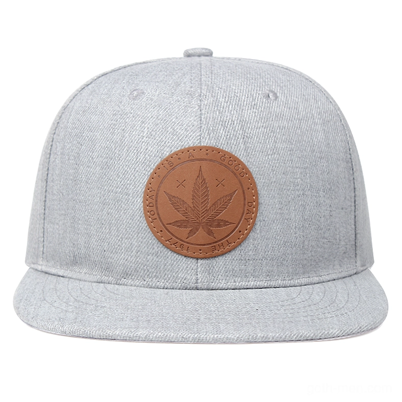 Direct front view of heather gray alternative cap, centered leather maple leaf patch
