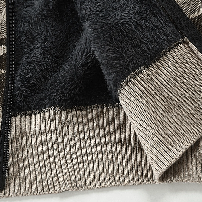 Fleece interior layer and ribbed knit hem construction detail of men's camouflage hooded cardigan sweater