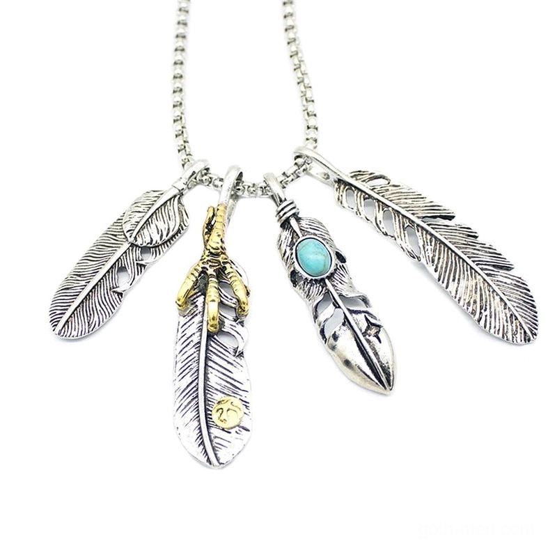Flat lay top view of four-leaf feather pendant necklace in gold-tone with mixed feather designs on white background