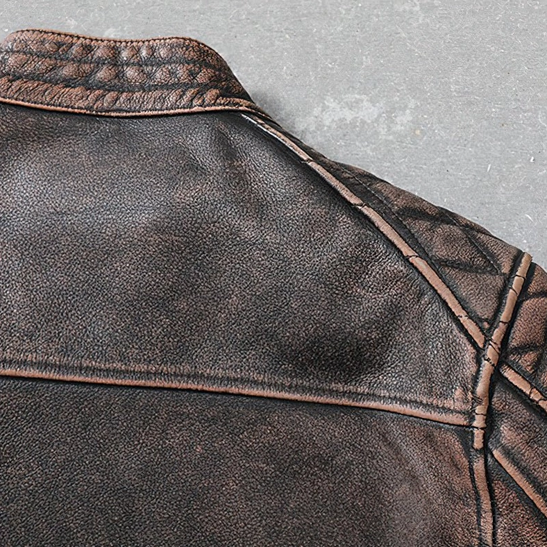 Additional detail view of distressed brown leather biker jacket construction and premium cowhide quality