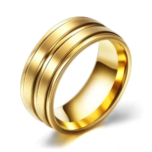 Gold-tone gothic band ring with high-polished finish and parallel groove details, alternative fashion jewelry