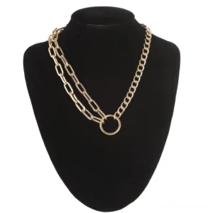Gold layered gothic chain choker necklace with double-layer mixed link chains and geometric circular connector on black mannequin display - front view