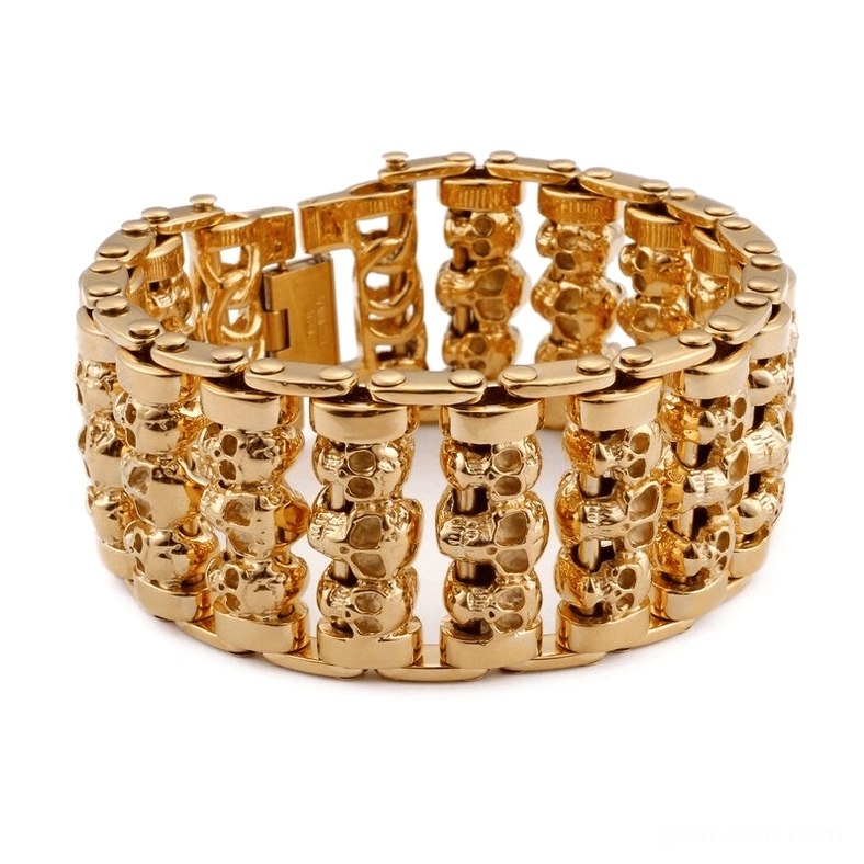 Gold gothic skull chain bracelet with dense skull link pattern and fold-over clasp