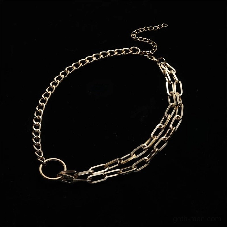 Gold gothic chain choker flat lay photography - paperclip style layered chains with circular clasp connector and geometric link design