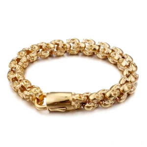 Gold stainless steel punk skull chain bracelet with interlocking skull links and spring ring clasp, overhead flat lay view