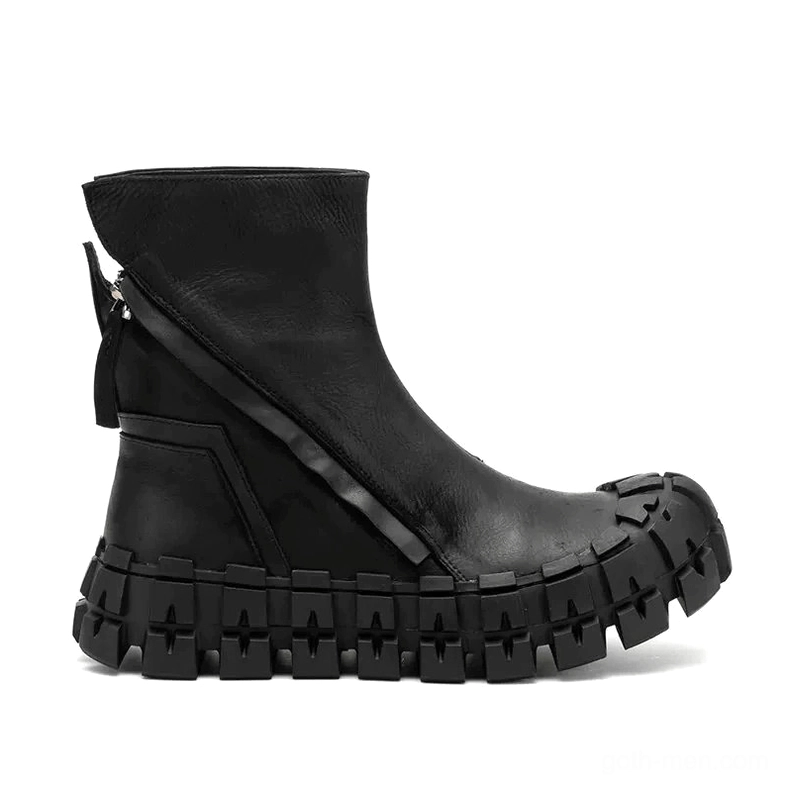 Full left side view of leather goth ankle boot highlighting structured segmented sole and precision stitching