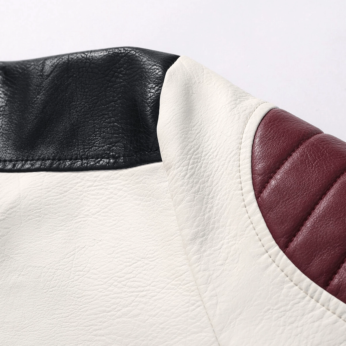 Shoulder and quilted wine red leather patch detail on gothic motorcycle jacket for men