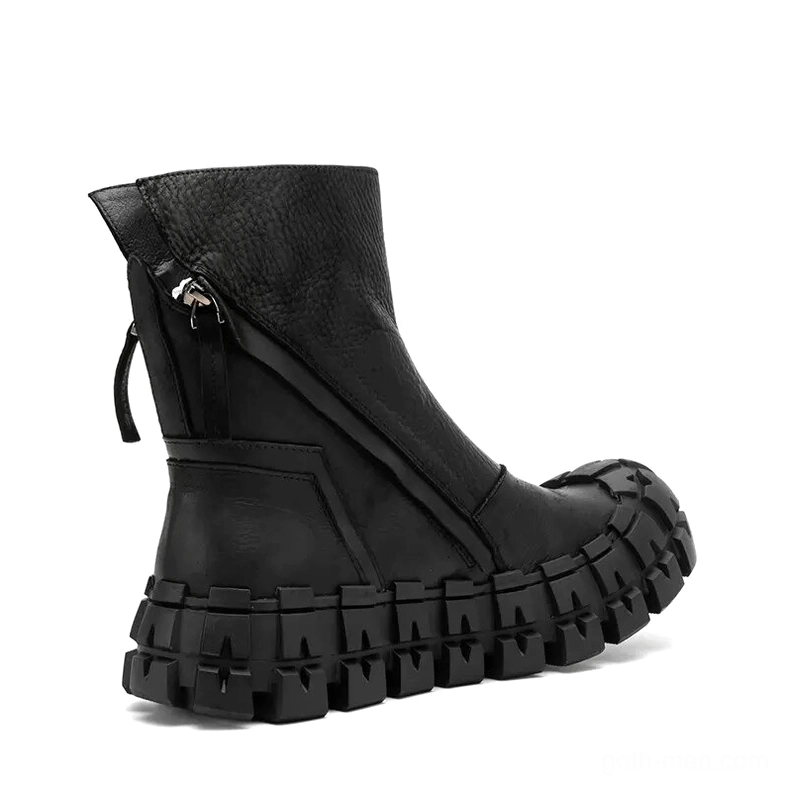 Rear side view of black goth ankle boot showcasing exposed zipper assembly and segmented rubber outsole