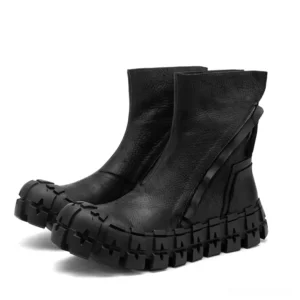 Black leather goth ankle boots with side zipper and heavy platform sole, three-quarter front view showing chunky treaded outsole