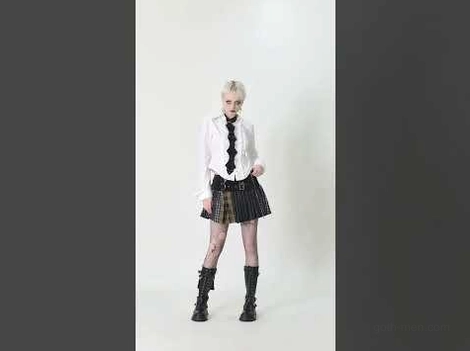 Complete goth look featuring black leather neck harness with mini skirt and combat boots