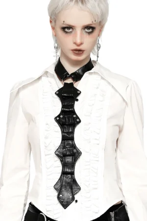 Gothic faux leather neck harness with silver rivets worn by model with goth makeup and white hair, front view against white studio background