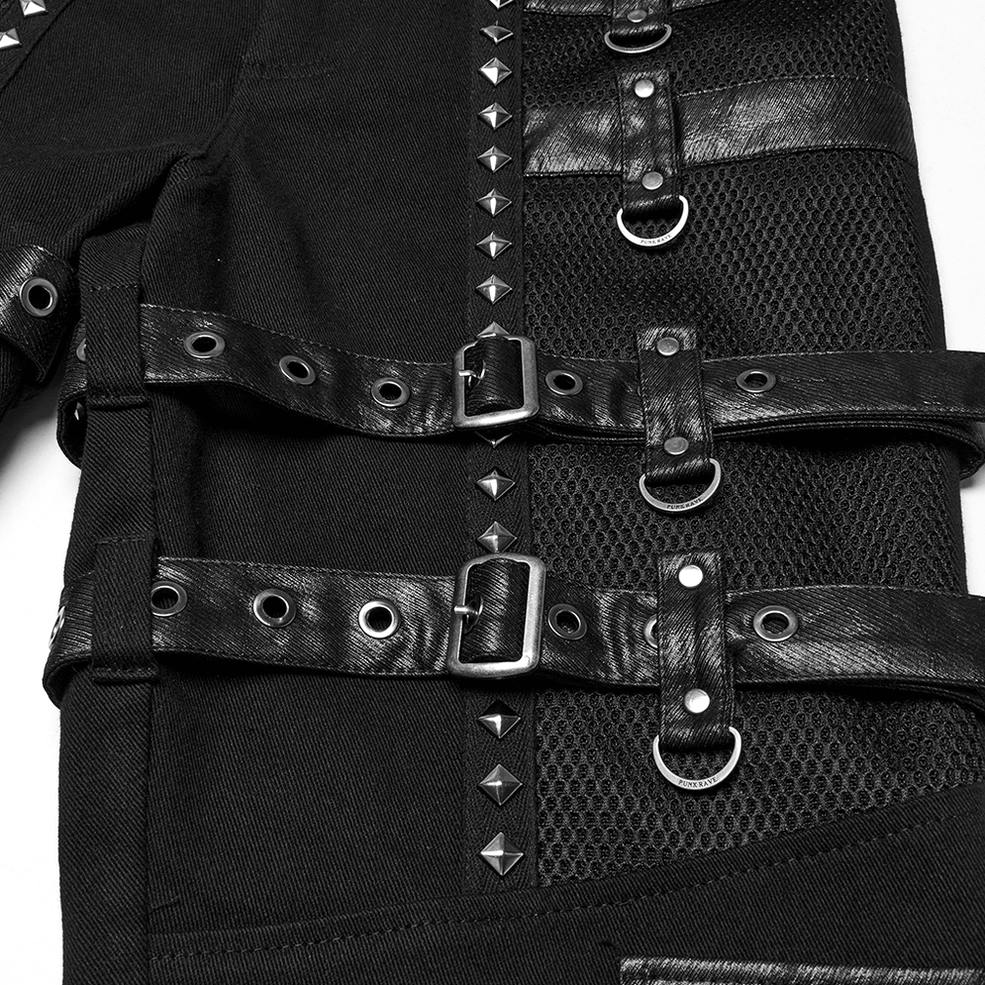 Detailed close-up of thigh strap with pyramid studs, buckled leather attachment, D-ring, and mesh fabric composition