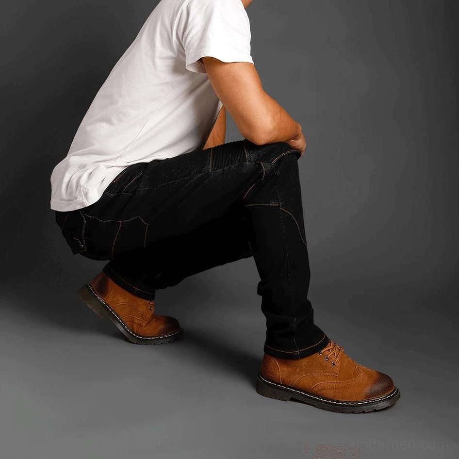 Full-length display of gothic protective armor jeans showing form-fitting cut, reinforced panels, and professional protective features