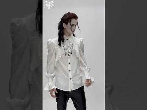 Victorian gothic white ruffled shirt with bell sleeves worn by male goth model against dark studio backdrop, showing button-down placket and dramatic collar styling with cross pendant accessory