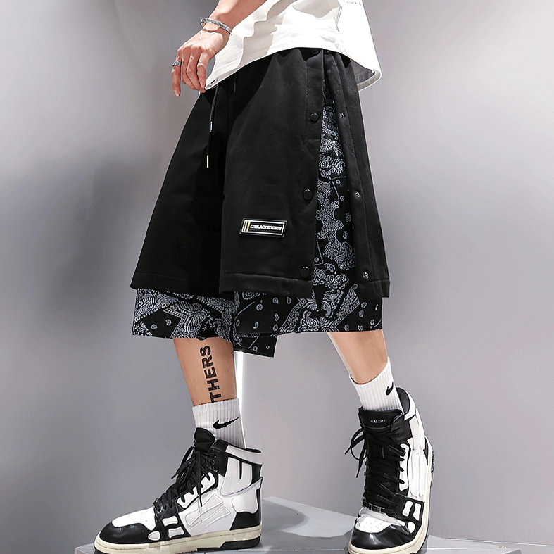 Alternative streetwear shorts with side snaps and paisley lining, gothic fashion styling example