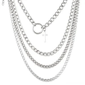 Flat lay of complete four-piece layered chain necklace set in silver tone with cross and o-ring charms, showing all four independent chains arranged