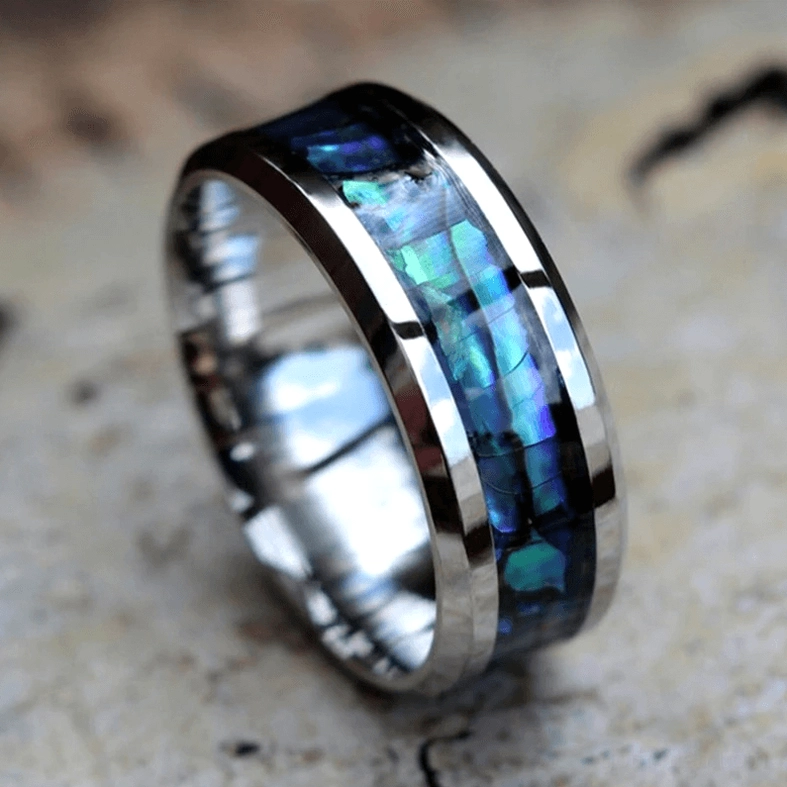 Abalone inlay ring top view with dual metal frame showcasing iridescent blue-green shell