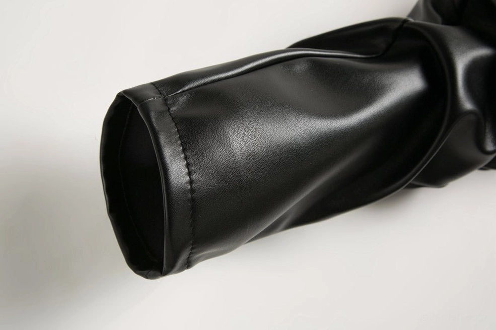 Pant hem and ankle cuff detail on slim fit gothic PU leather pants with clean finished edges