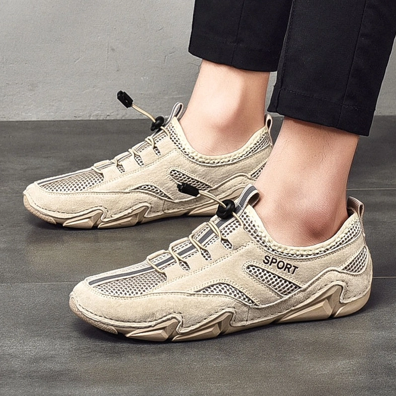 Gothic alternative casual sneaker in neutral palette - three-quarter view of PU leather upper