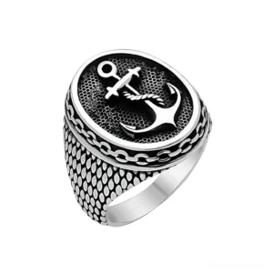 Gothic anchor signet ring stainless steel - front flat lay view showing detailed anchor emblem with rope and scale band texture