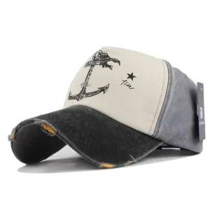 Black and gray alternative snapback hat with anchor star print and worn distressed edges, studio view