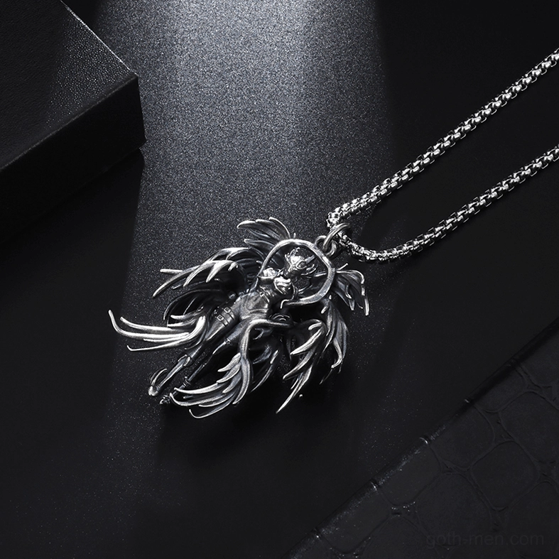Low angle side close-up of gothic winged angel pendant emphasizing intricate layered wing details, craftsmanship, and three-dimensional depth