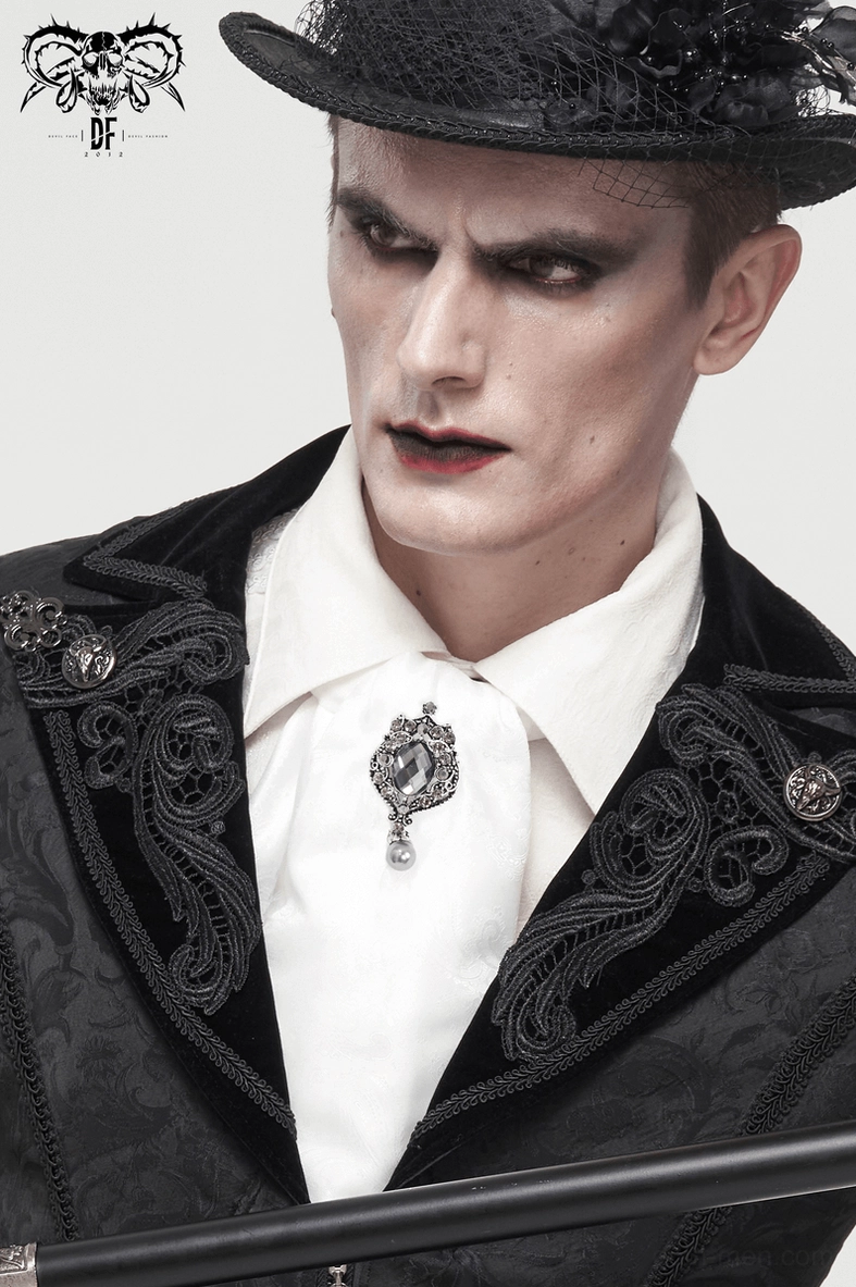 Gothic formal wear featuring white ascot tie with crystal detail and cane accessory
