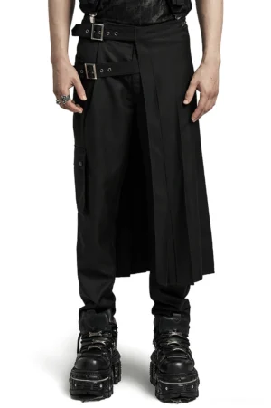 Black asymmetrical pleated gothic skirt with adjustable hardware buckle worn by male model, front three-quarter view showing structure and buckle detail