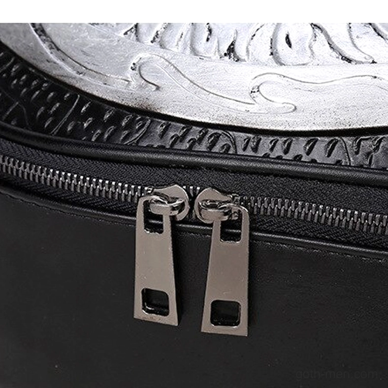 Dual metal zipper pulls on embossed leather gothic backpack technical detail