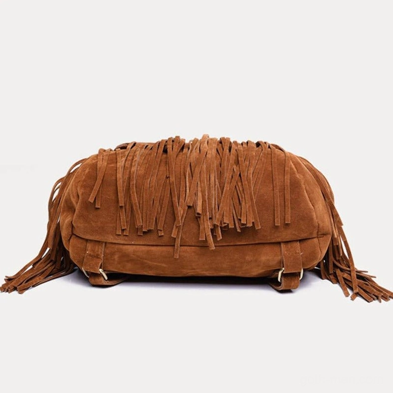 Close-up of tassel fringe detail on brown suede goth backpack showing craftsmanship and metal base fasteners