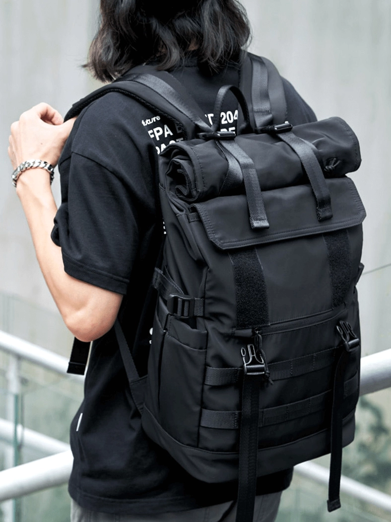 Gothic roll-top backpack internal organization with multi-layer compartments and zippered pockets