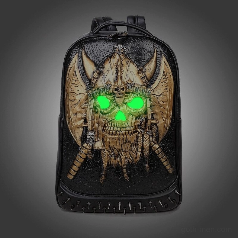 Gold embossed skull gothic backpack with green glowing eye effect dark background