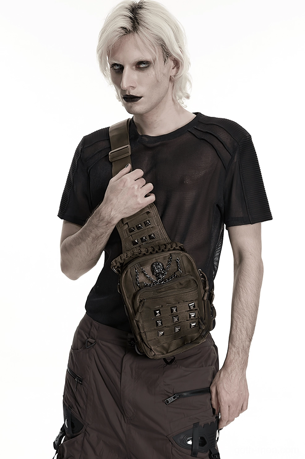 Side angle view of gothic skull pyramid stud crossbody backpack showing profile construction and strap adjustment