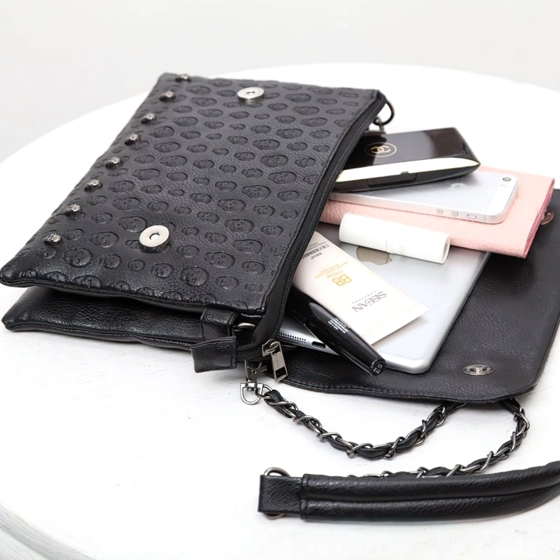 Open gothic leather shoulder bag flat lay showing interior capacity, magnetic snap closure and chain shoulder strap