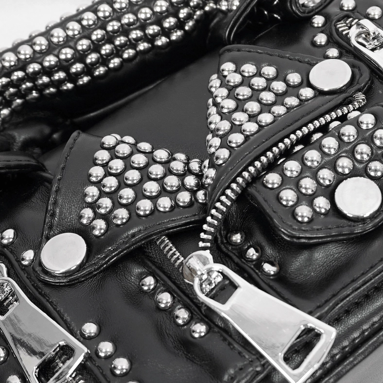 Close-up macro view of silver metal rivets zippers and punk leather texture details