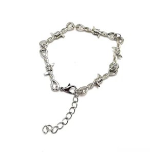 Unisex gothic barbed wire bracelet flat lay, showing lobster clasp and adjustable extension chain detail