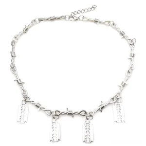 Silver gothic barbed wire choker laid flat overhead view showing adjustable extension chain tail and full pendant width - top-down product shot