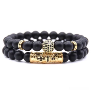Gold-toned gothic dual-strand beaded bracelet with diamond-paved ball accent and natural stone beads, flat lay view
