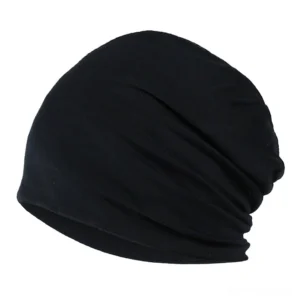 Black solid stretch gothic beanie hat with natural fabric draping and minimalist aesthetic