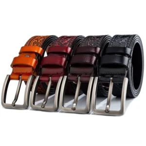 Collection of men's embossed gothic leather belts in multiple colors displaying various floral and geometric patterns