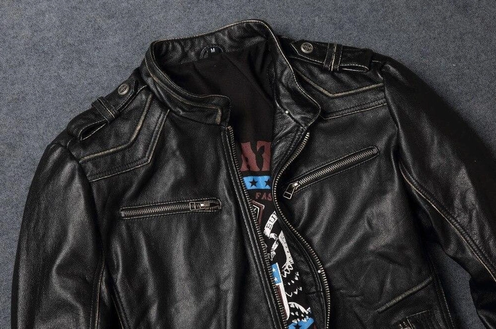 Black distressed cowhide leather biker jacket with embroidered cross for gothic styling