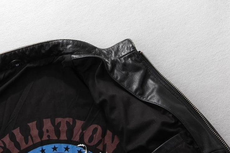 Leather motorcycle jacket inner printed lining with partial text graphic and zipper