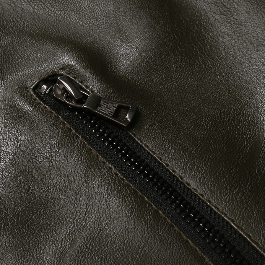 Black gothic biker jacket shoulder detail showing metal snap buttons and textured PU leather