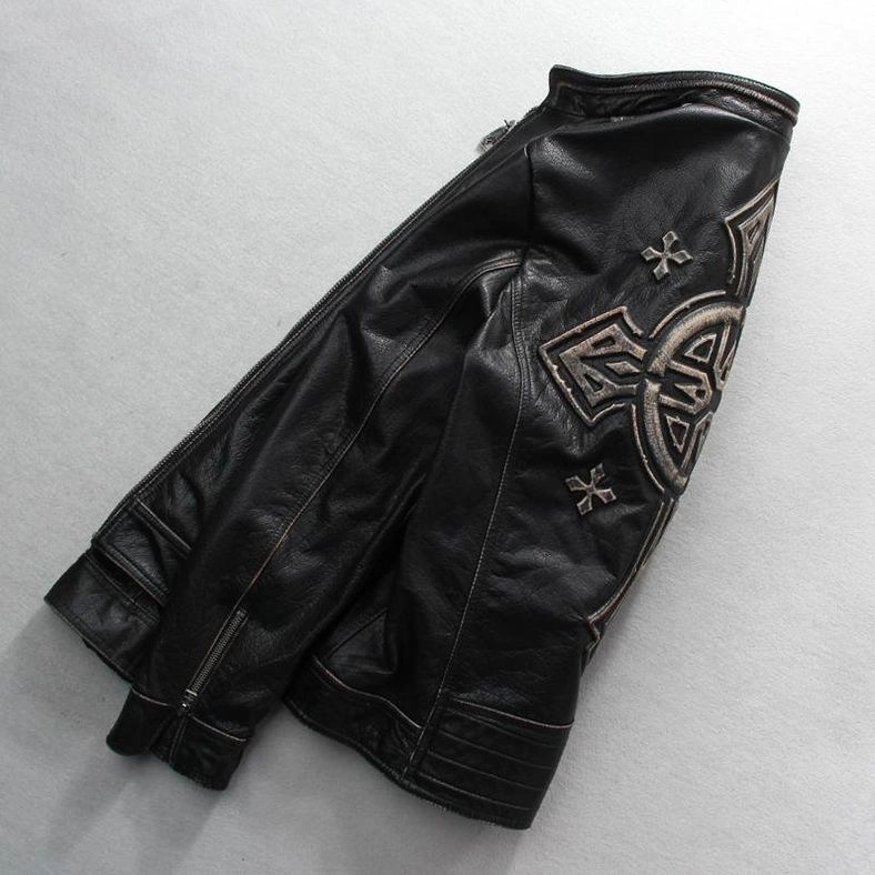 Vintage black leather biker jacket side view with cross embroidery and ribbed cuffs